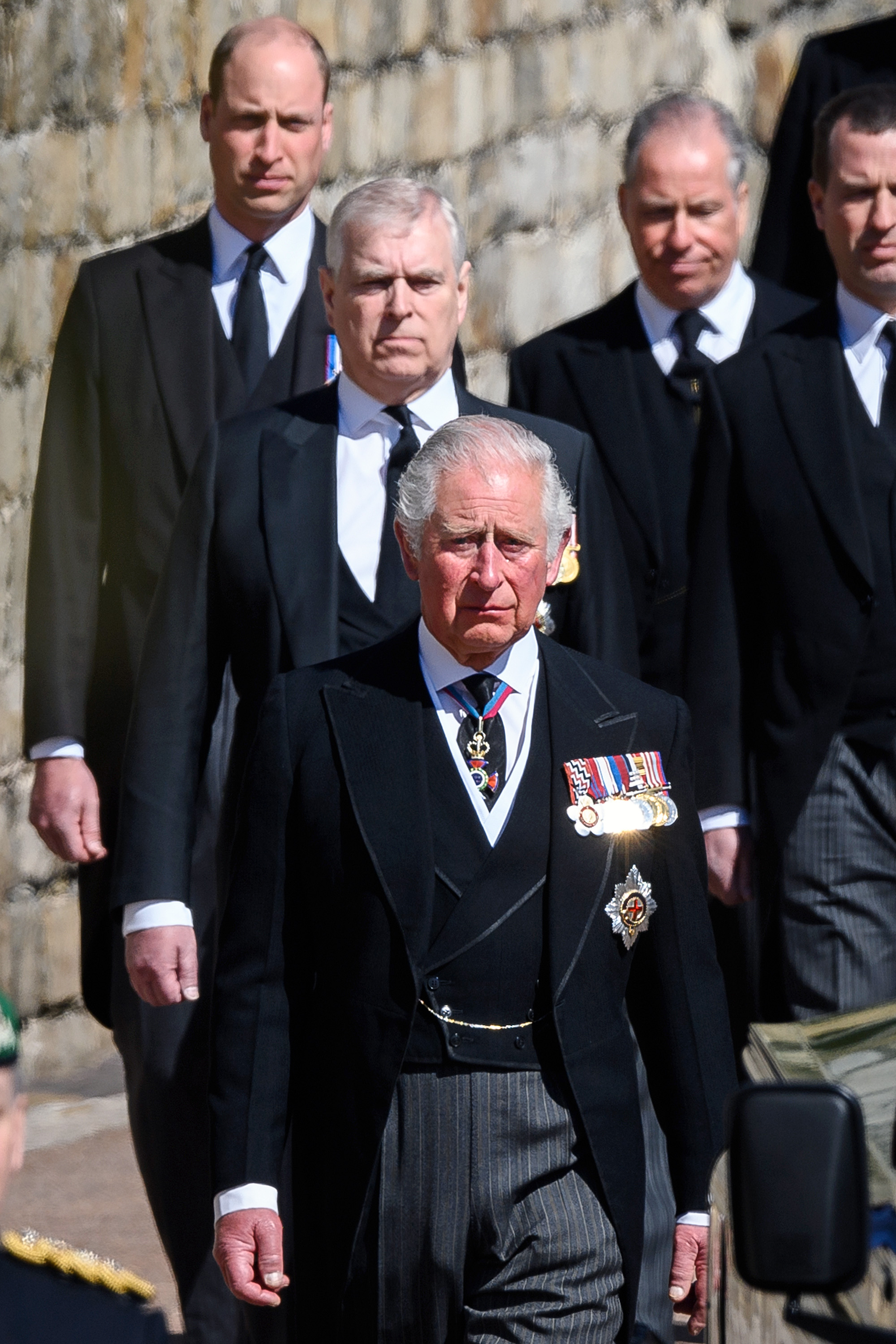 Prince William walking behind Prince Andrew and King Charles at Prince Philip's funeral