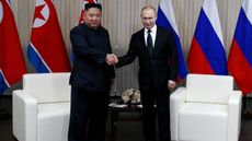Kim Jong Un and Vladimir Putin shake hands during their 2019 meeting in Vladivostok, Russia