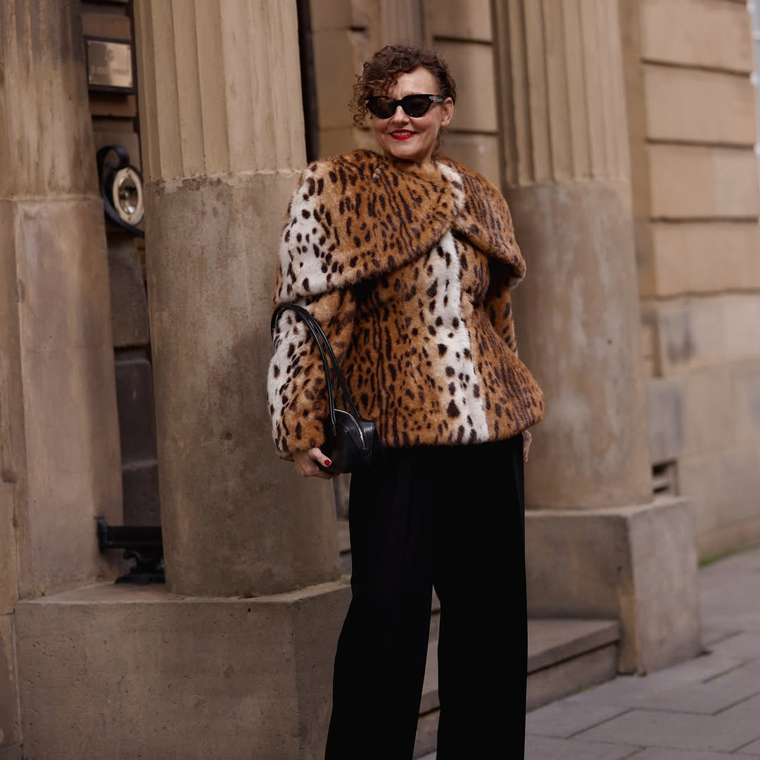 @venswifestyle wearing an animal print jacket and trousers