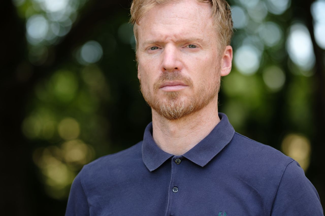 Viltrox AF 90mm F2.2 EVO and Fujifilm XF 90mm f/2 R LM WR lens comparisons: upper body portrait of a man with backlit trees