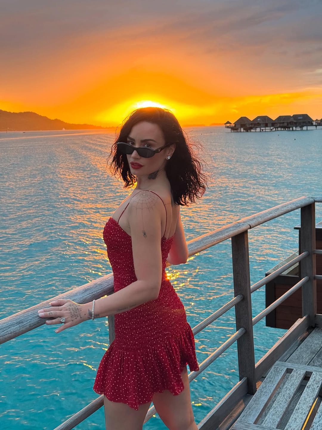 Demi Lovato wears a red polka-dot Reformation dress on her honeymoon