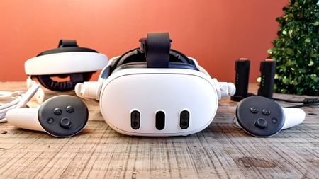Meta Quest 3 with VR accessories on table 