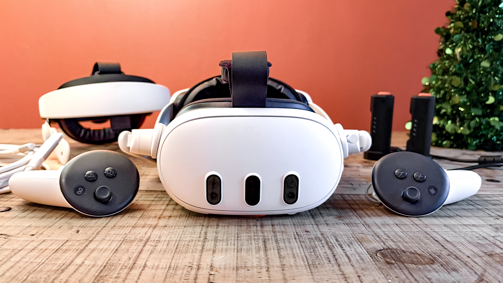 Meta Quest 3 with VR accessories on table 