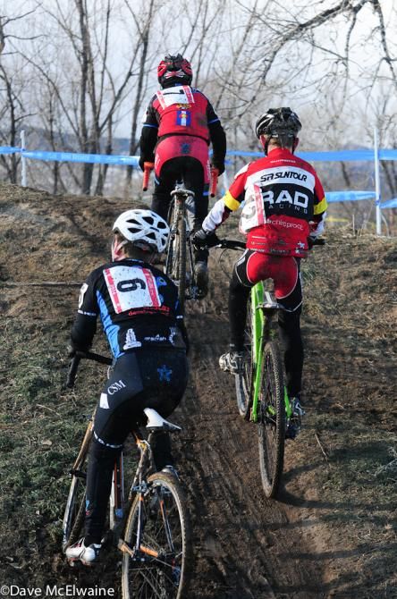 Riders fighting their way up a steep climb