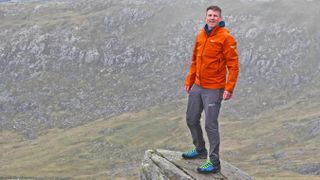 Man wearing Salewa Puez Gore-Tex Paclite Jacket while standing on Cannon Rock on Tryfan, Snowdonia