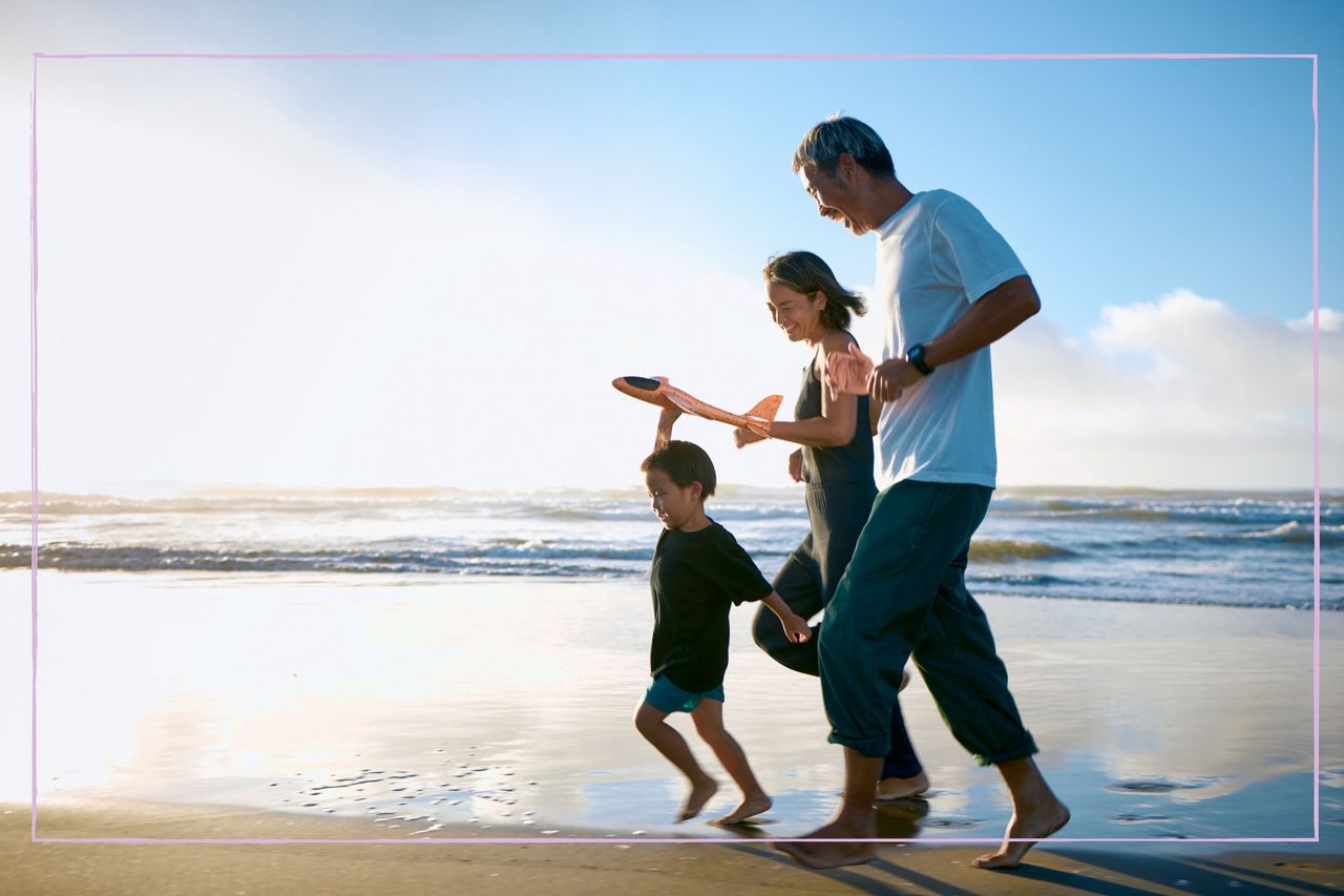 When does summer start as illustrated by a family on the beach on a warm day