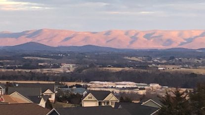 The Blue Ridge mountains in the distance from a residential neighborhood in Staunton, Va.