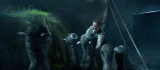 Jacob (Dan Fogler) feeds a herd of mooncalves. Their design was inspired by otters, goats, cats, giraffes, and Vietnamese pigs.