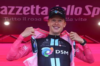 Team DSMs Norwegian rider Andreas Leknessund celebrates his overall leaders pink jersey on the podium after the fourth stage of the Giro dItalia 2023 cycling race 175 km between Venosa and Lago Laceno on May 9 2023 Photo by Luca Bettini AFP Photo by LUCA BETTINIAFP via Getty Images