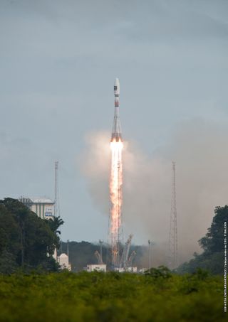 A Russian-built Soyuz rocket launches Europe's first two operational Galileo navigation system satellites into space from Guiana Space Center in Kourou, French Guiana. The satellites were ultimately left in the wrong orbit, prompting an investigation into