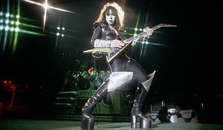 Vinnie Vincent performs onstage with Kiss in 1983
