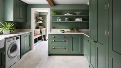 painted green kitchen with boot room
