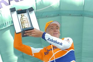 Robert Gesink holds up his trophy for winning the Giro dell'Emila