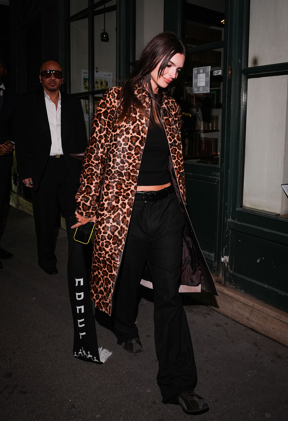 Woman wearing the animal-print coat trend of fall/winter 2025.