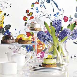 exotic cakes and stand with flower vase