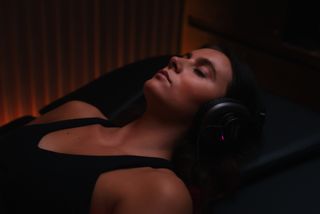 woman in headphones, sleeping