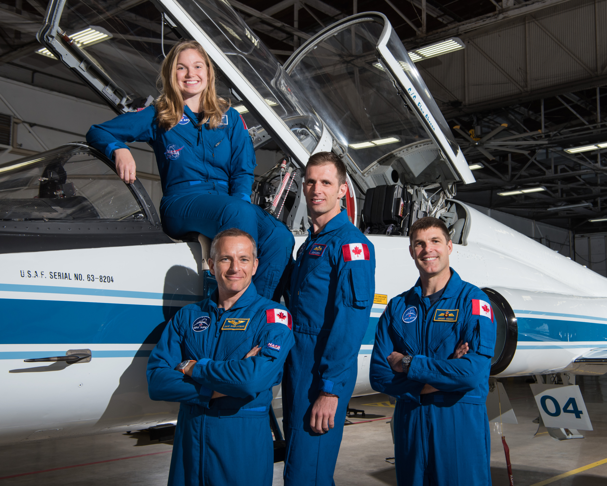 The Canadian Space Agency's active astronaut corps. From left, standing: David Saint-Jacques, Joshua Kutryk, Jeremy Hansen. Sitting on T-38N Talon plane: Jenni Gibbons.