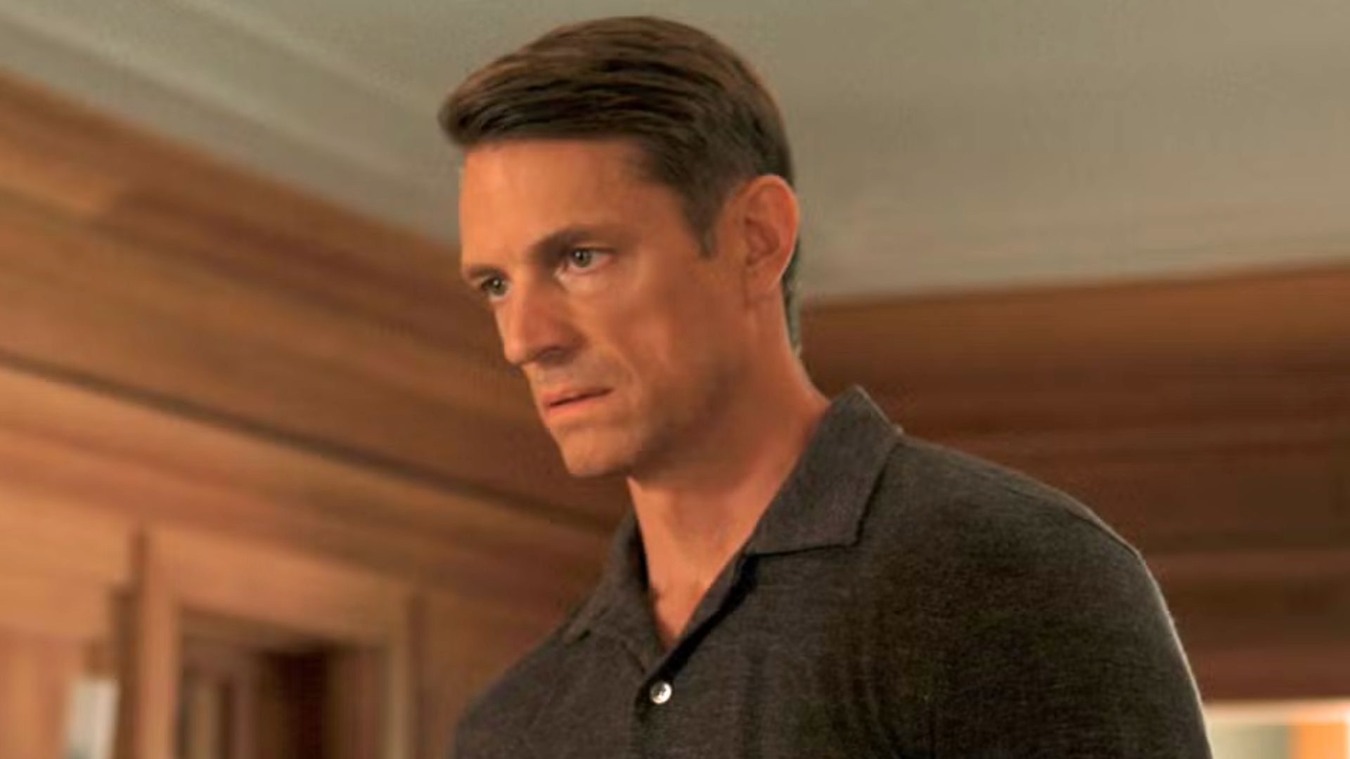 Joel Kinnaman looks at someone offscreen