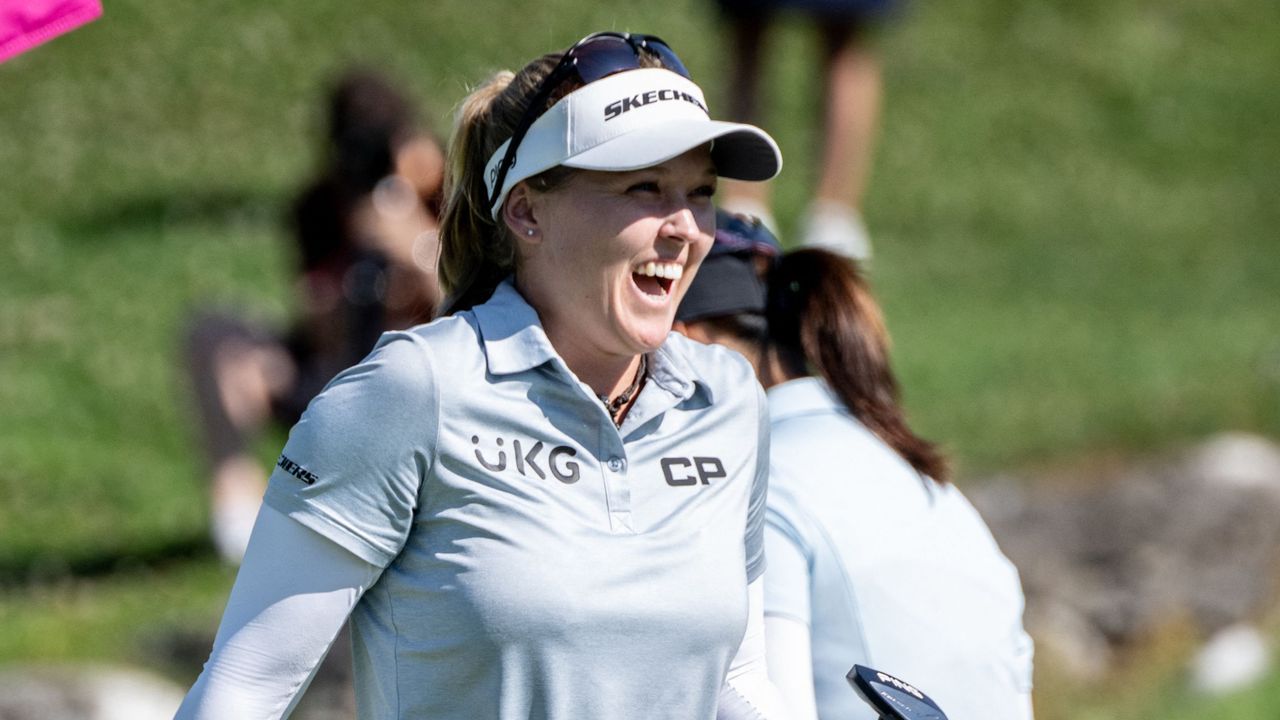 Brooke Henderson celebrates after her win in the 2022 Evian Championship in France