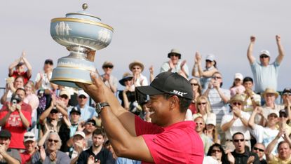 Tiger Woods celebrates with the trophy after winning the 2008 WGC-Match Play
