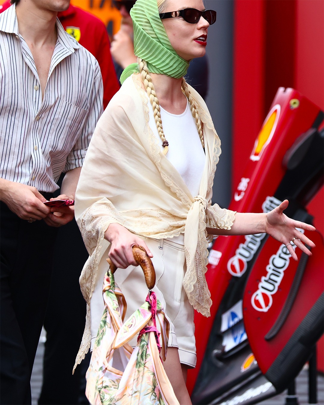 Anya Taylor-Joy wears the Farm Rio bag. She pairs its with a lace shawl and a green headscarf in a recent image.