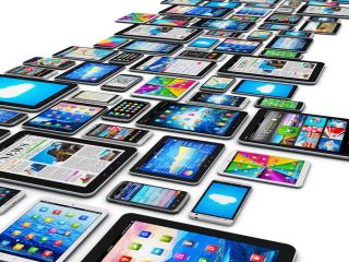 Array of various mobile devices with colorful screens