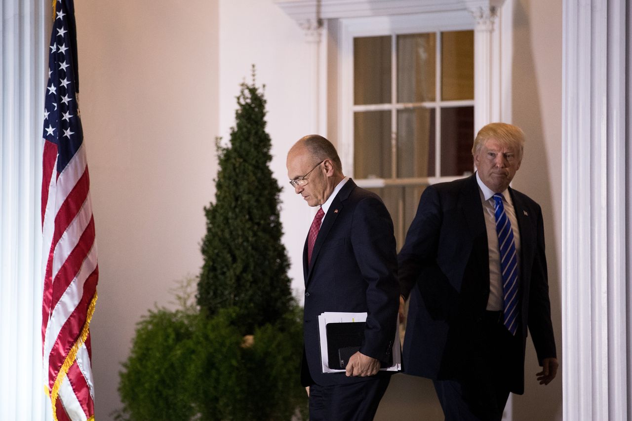 Andrew Puzder departs after a meeting with Donald Trump