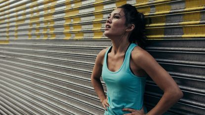 woman resting and sweating after exercise