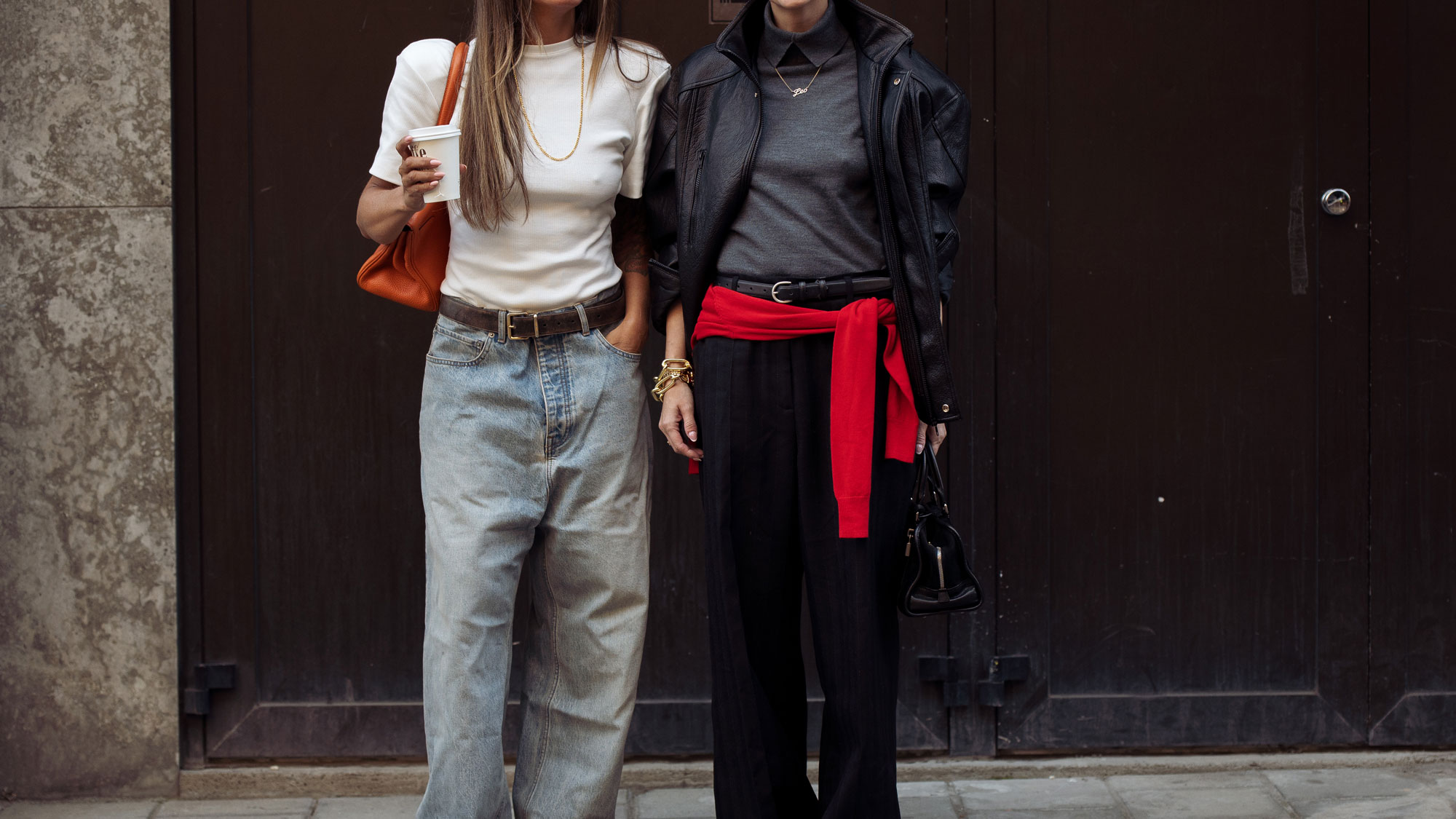 two women wearing sweaters
