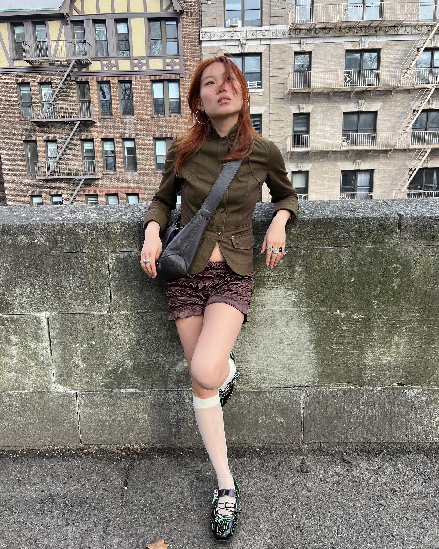 An image of @vivianyrl wearing bloomer shorts with sneakerinas, one of the best lace-up flats.