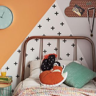 A geometric wall mural for a teenage bedroom designed by Dulux