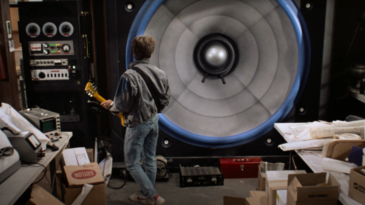 Michael J. Fox stands in front of a massive amp in Back To The Future.
