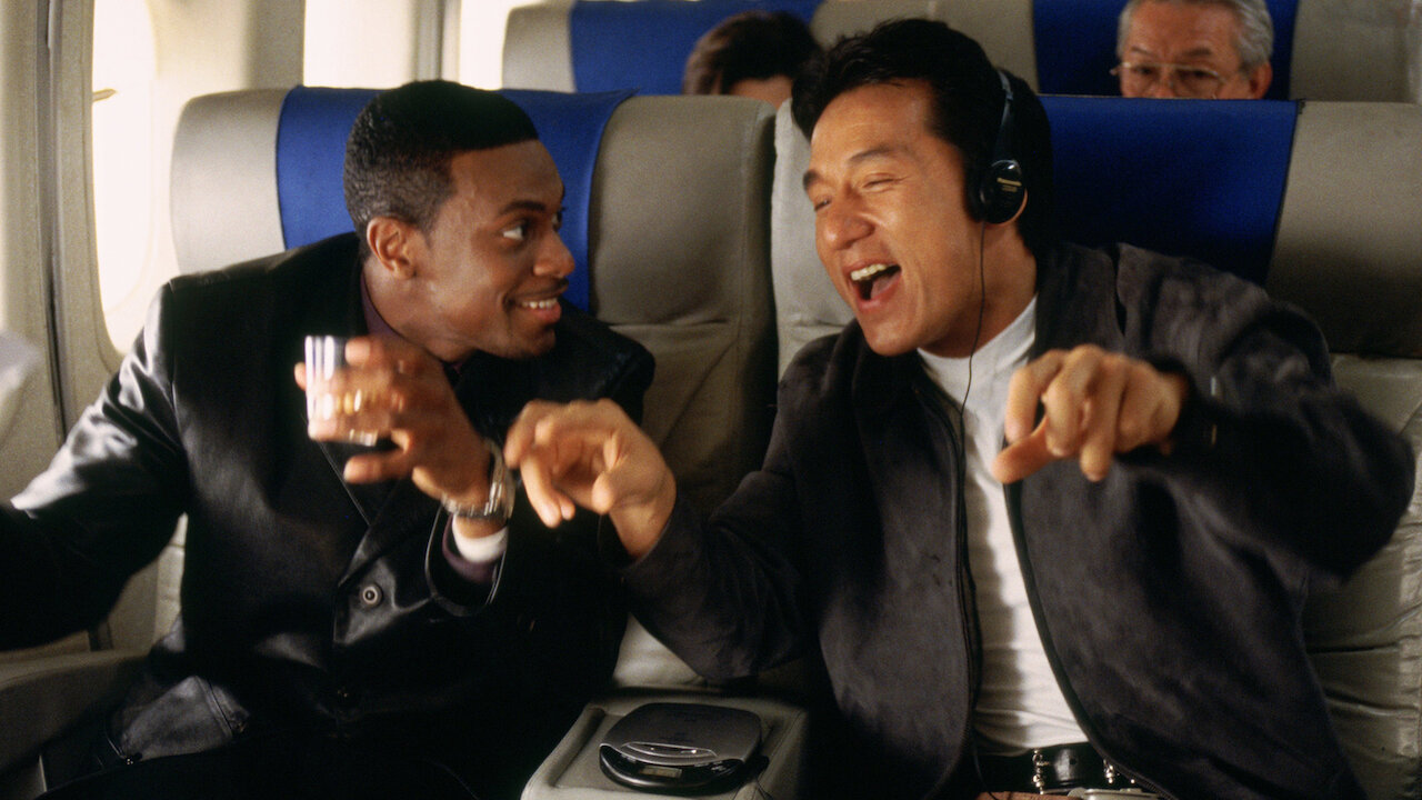 Chris Tucker and Jackie Chan on an airplane in Rush Hour