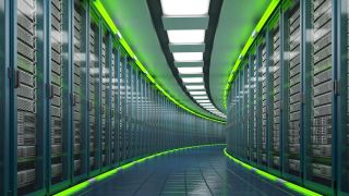 Curving corridor of servers gleams with green lights