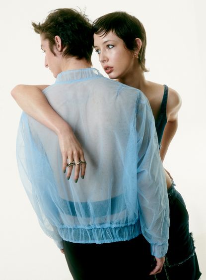 Two people embracing wearing sheer clothing by Act No 1