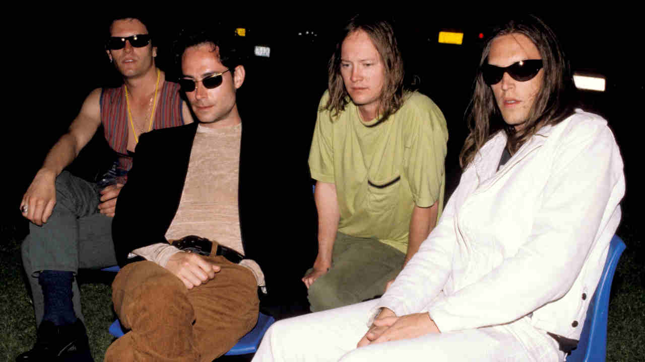 Urge Overkill posing for a photograph