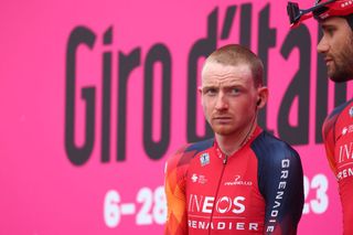 INEOS Grenadierss British rider Tao Geoghegan Hart stands on the podium during the teams presentation prior to the seventh stage of the Giro dItalia 2023 cycling race 218 km between Capua and Gran Sasso dItalia on May 12 2023 Photo by Luca Bettini AFP Photo by LUCA BETTINIAFP via Getty Images