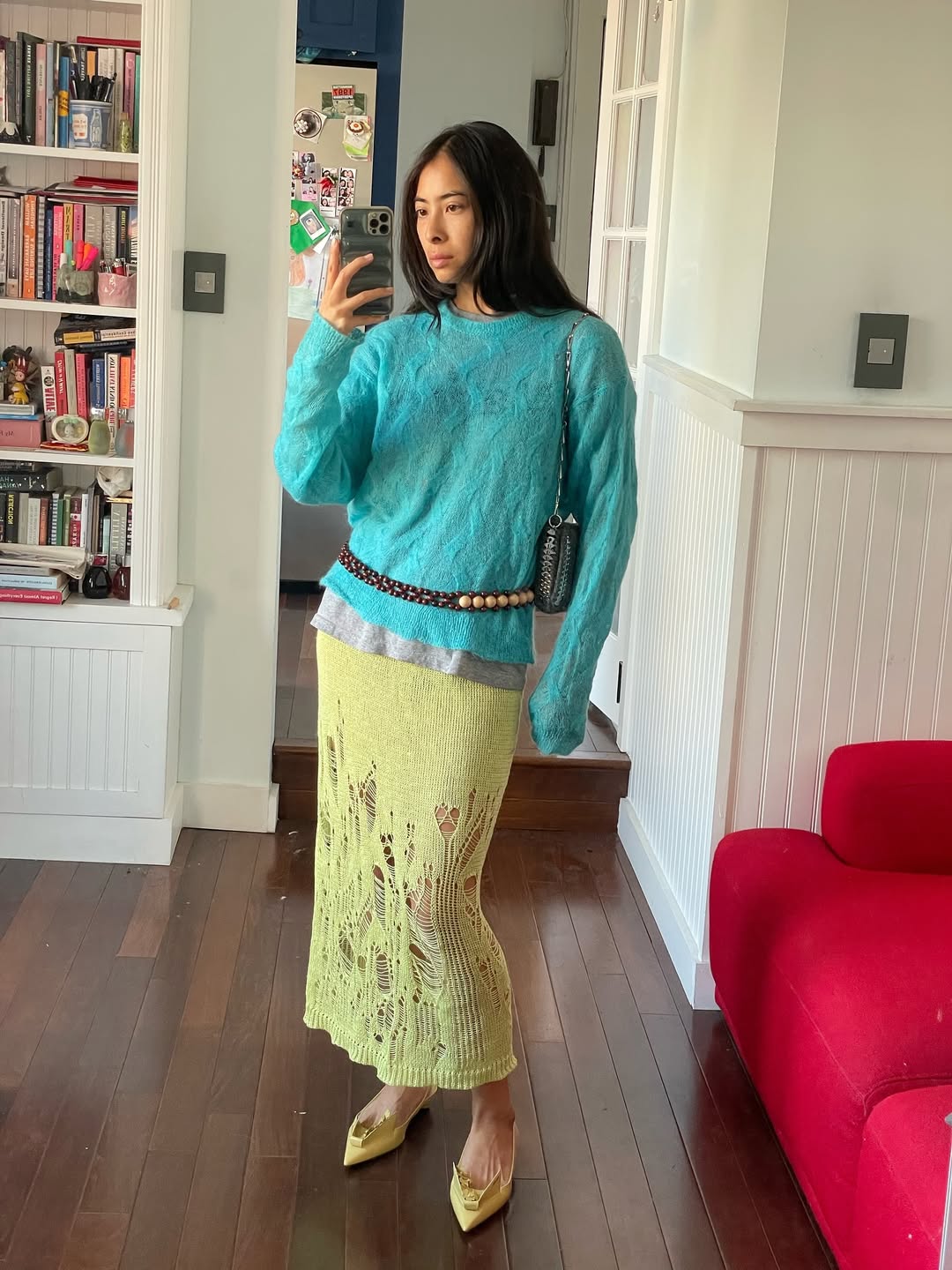 Michelle Li in a teal sweater.