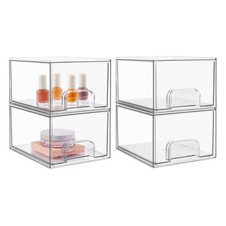 Two sets of clear plastic 2-drawer storage units, one empty, one with nail varnish inside. 