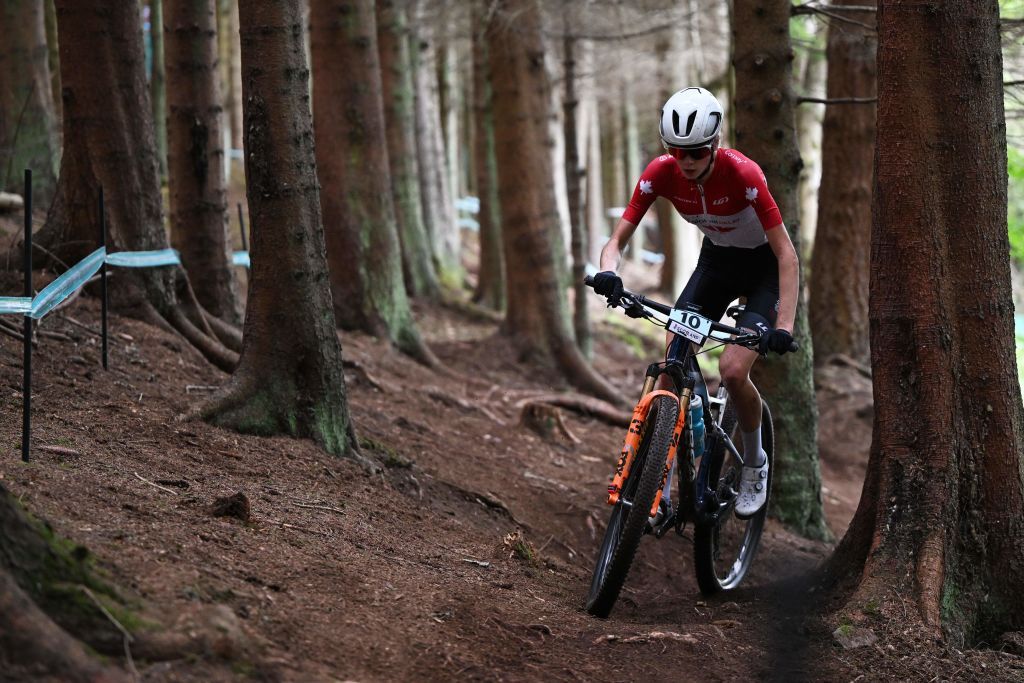 Canadas Isabella Holmgren takes part in the womens Junior Crosscountry Olympic mountain bike race at the Cycling World Championships in Glentress Forest Scotland on August 10 2023 Photo by Oli SCARFF AFP Photo by OLI SCARFFAFP via Getty Images