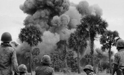 Smoke rises from bombs dropped by U.S. planes near the Cambodian capital of Phnom Penh July 25, 1973.