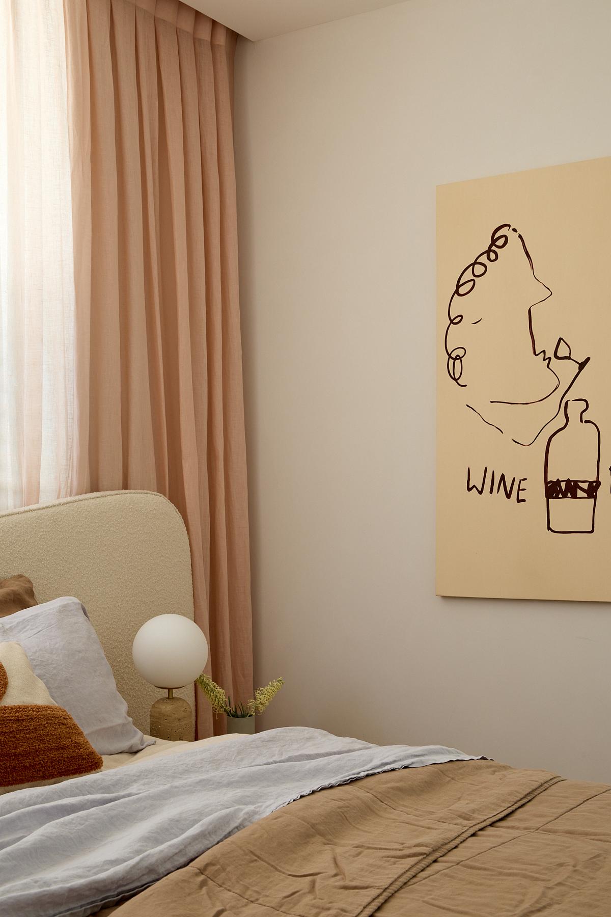 A bedroom with pale pink curtains and a neutral color scheme