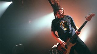 Bassist Chi Cheng performs live with his band, The Deftones at the University of California, Irvine Bren Events Center October 23, 2000 in Irvine, CA. 
