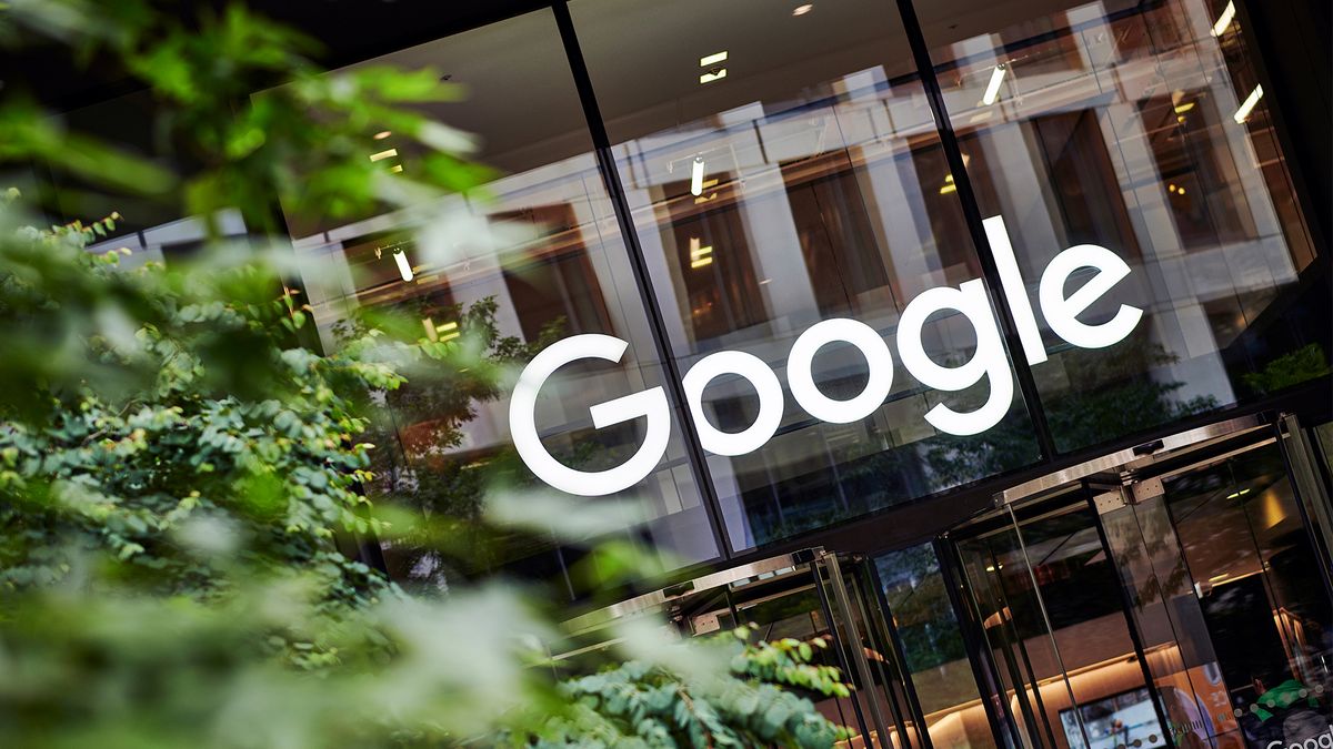 Google logo and branding pictured on front of an office entrance at King&#039;s Cross, London, UK. 