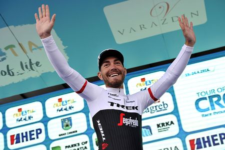 Giacomo Nizzolo (Trek-Segafredo) give a victory salute on the stage 1 podium after winning the sprint