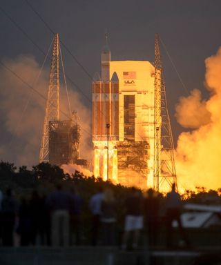 A Delta 4 Heavy rocket carrying NASA’s Orion spacecraft lifts off from Cape Canaveral Air Force Station at at 7:05 a.m. EST, Dec. 5, 2014, in Florida. Launch was postponed one day because of technical glitches and weather.