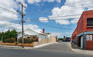 The timber wall acts as a privacy screen and a security fence