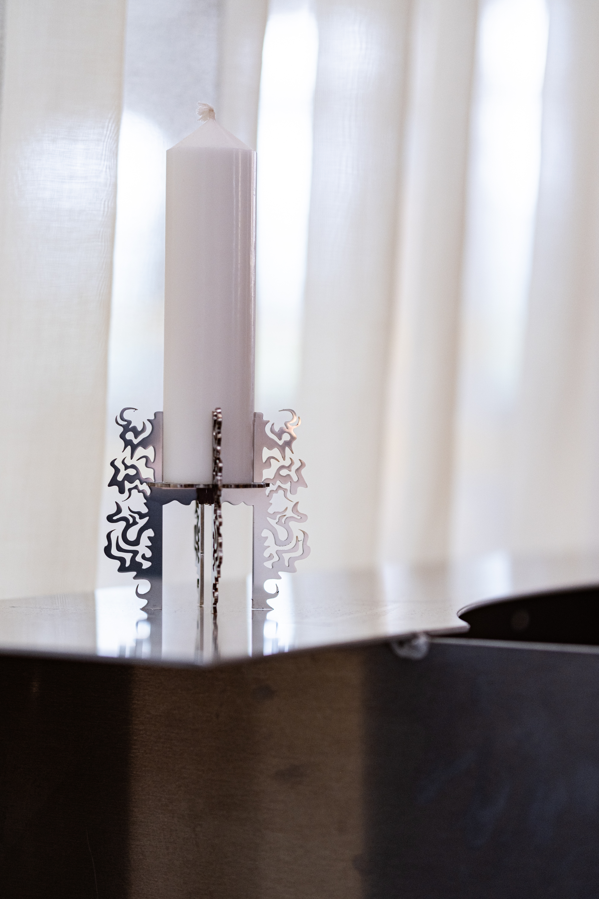 A candle holder and table by My Come╠üt at 'Going Pro'. Photo by Form Design Center