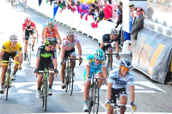 The lead group crosses the line at Mur-de-Bretagne at the end of stage 4 of the Tour de France.