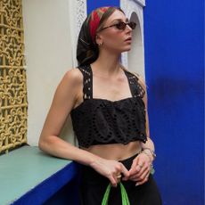 Influencer handbag wish list winter 2026: lou northcote wears a bandana, black top and green handbag